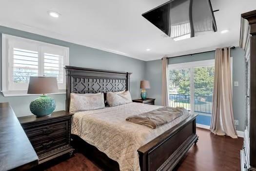 bedroom with access to exterior, recessed lighting, and dark wood-type flooring