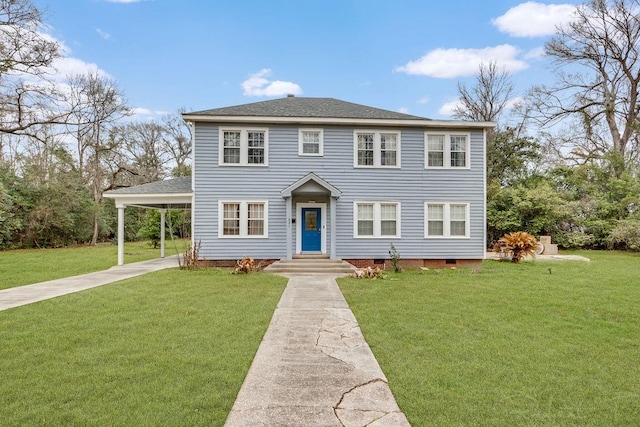 colonial home with an attached carport and a front yard