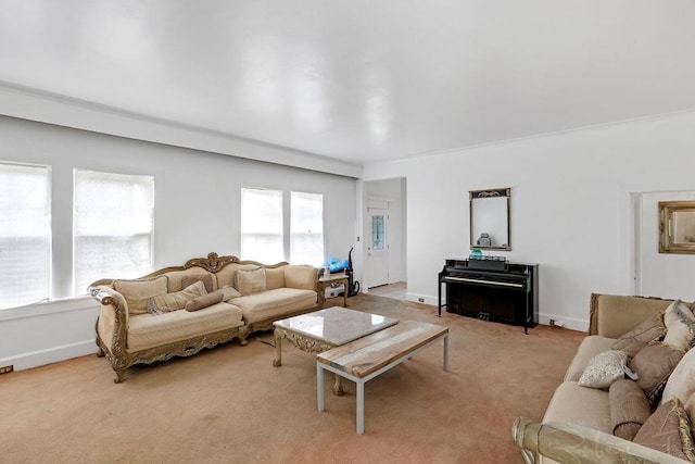 living area featuring light colored carpet and baseboards