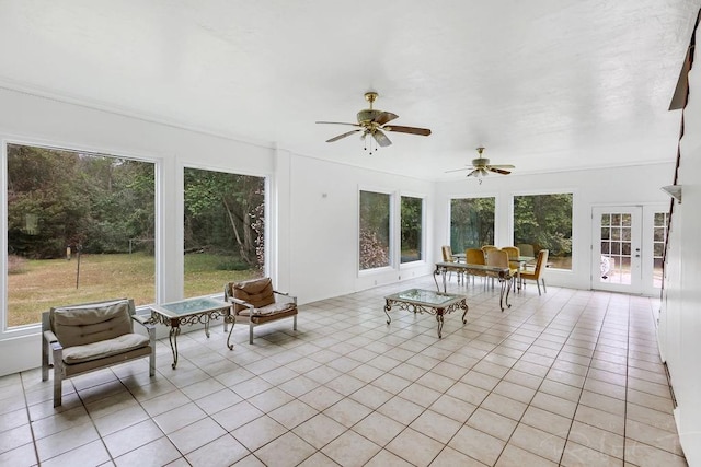 sunroom featuring french doors and ceiling fan