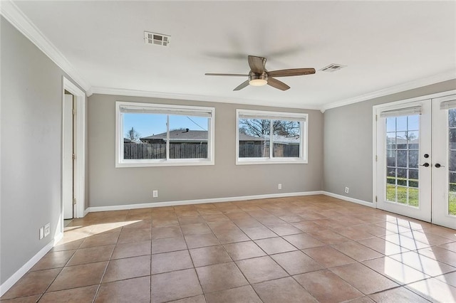 tiled spare room with visible vents, french doors, and crown molding