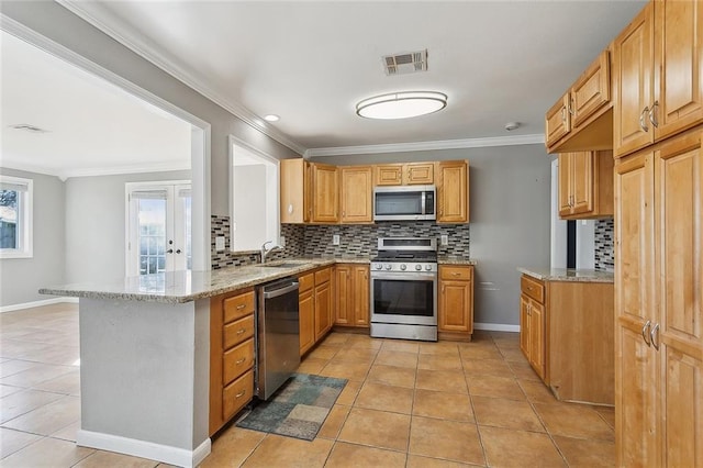 kitchen with light tile patterned floors, visible vents, appliances with stainless steel finishes, and decorative backsplash