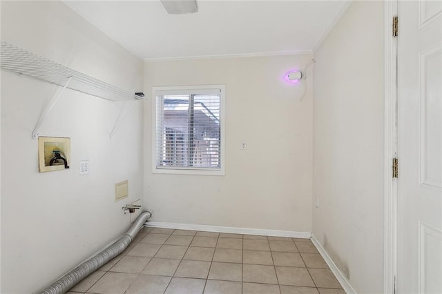 clothes washing area with baseboards, washer hookup, laundry area, and crown molding