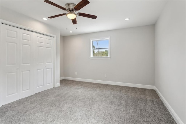 unfurnished bedroom with recessed lighting, carpet, baseboards, and a closet