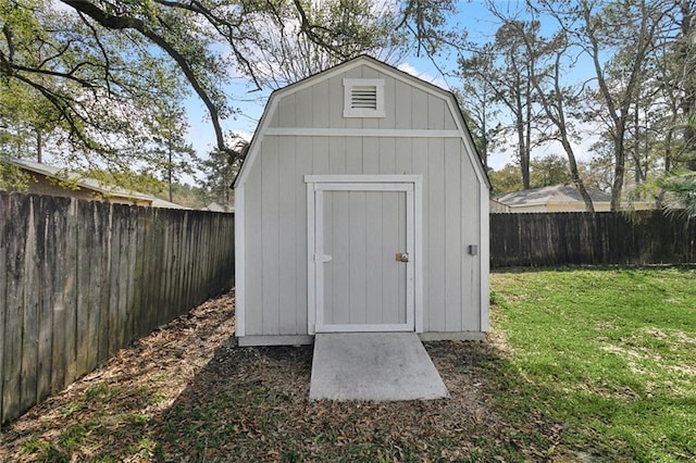 view of shed with a fenced backyard