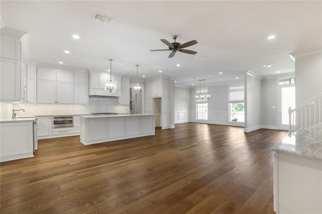 kitchen with visible vents, white cabinets, and light countertops