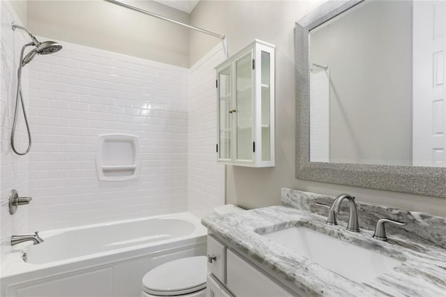 full bathroom with toilet, vanity, and bathtub / shower combination