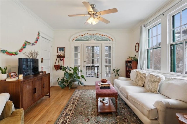 sunroom / solarium featuring ceiling fan