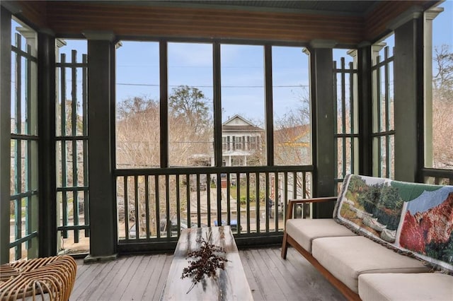 sunroom / solarium featuring a healthy amount of sunlight