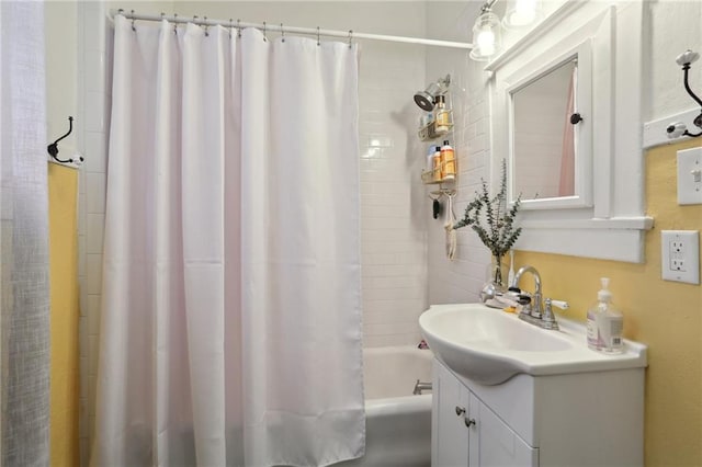 full bath featuring vanity and shower / bath combination with curtain