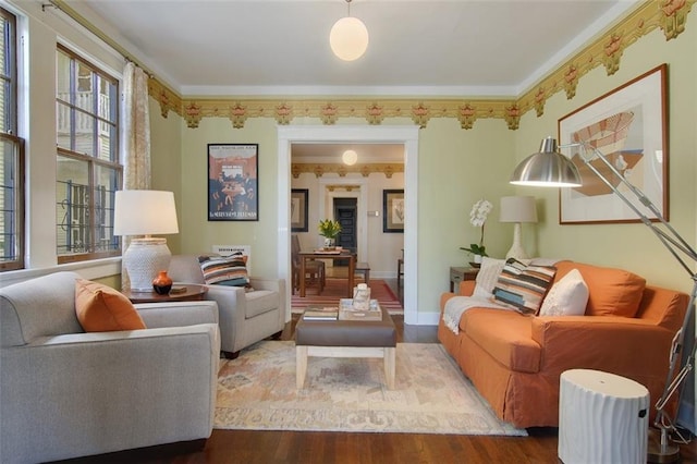 sitting room featuring baseboards and wood finished floors