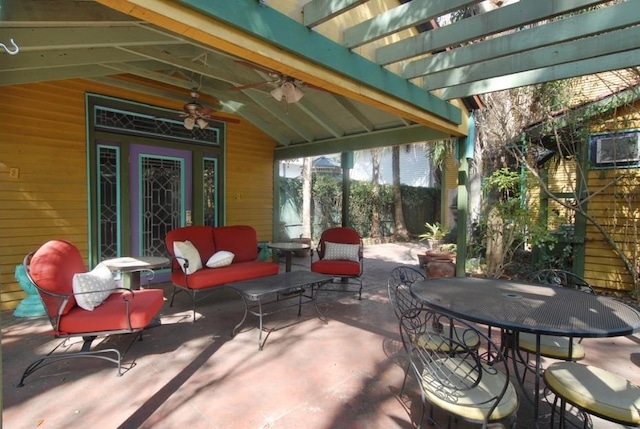 view of patio / terrace with outdoor dining area, an outdoor hangout area, and a ceiling fan