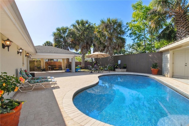 view of pool with a fenced in pool, a patio, and a fenced backyard