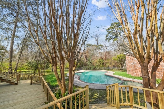 deck featuring a fenced in pool and fence