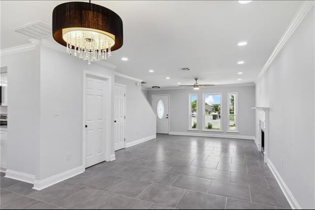 foyer entrance featuring a fireplace, recessed lighting, baseboards, and ornamental molding