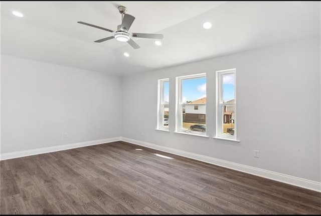 unfurnished room with dark wood finished floors, recessed lighting, a ceiling fan, and baseboards