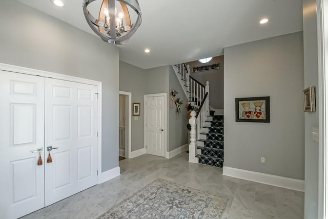 foyer entrance with recessed lighting, stairway, and baseboards