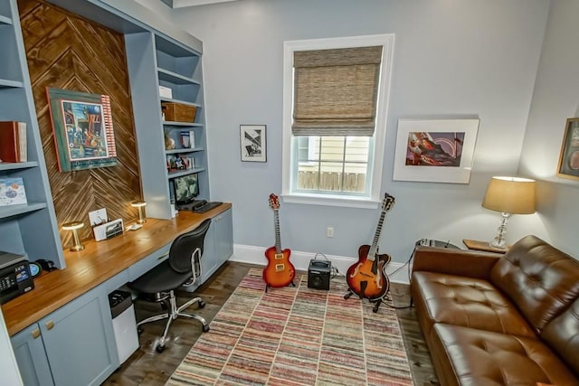 office area featuring baseboards and built in study area