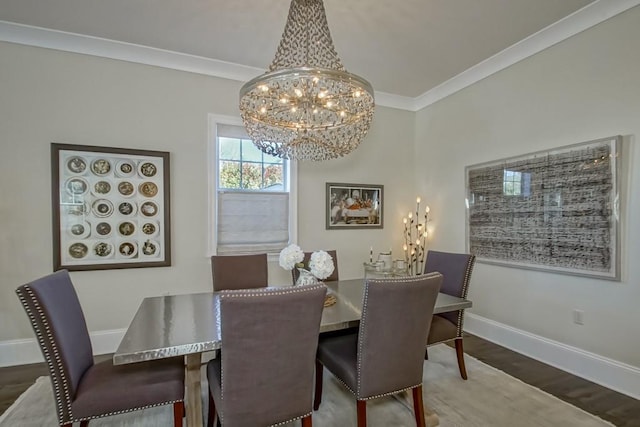 dining space featuring wood finished floors, baseboards, a notable chandelier, and ornamental molding