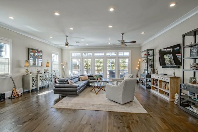 living area featuring baseboards, ornamental molding, recessed lighting, wood finished floors, and a ceiling fan