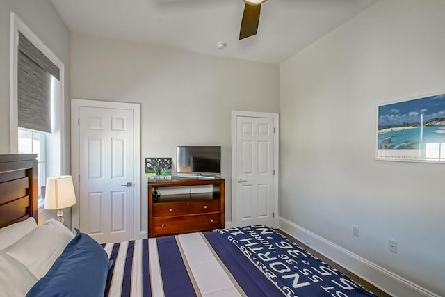 bedroom featuring a ceiling fan and baseboards