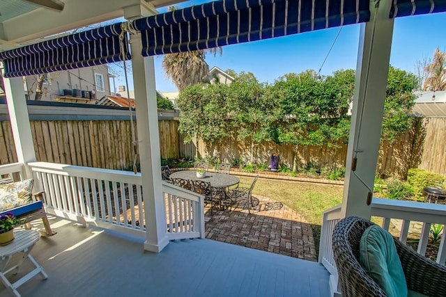 view of patio / terrace featuring outdoor dining space and a fenced backyard