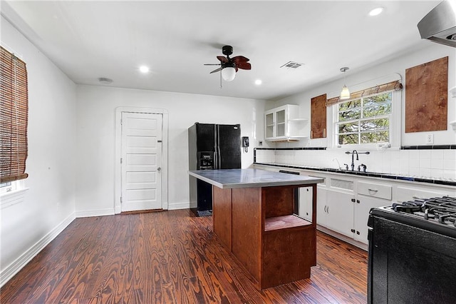 kitchen with visible vents, black appliances, open shelves, dark wood-style floors, and white cabinets