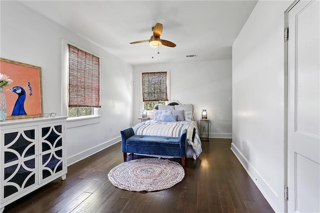 bedroom with visible vents, ceiling fan, baseboards, and wood-type flooring