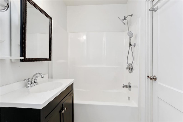 full bathroom with shower / washtub combination and vanity