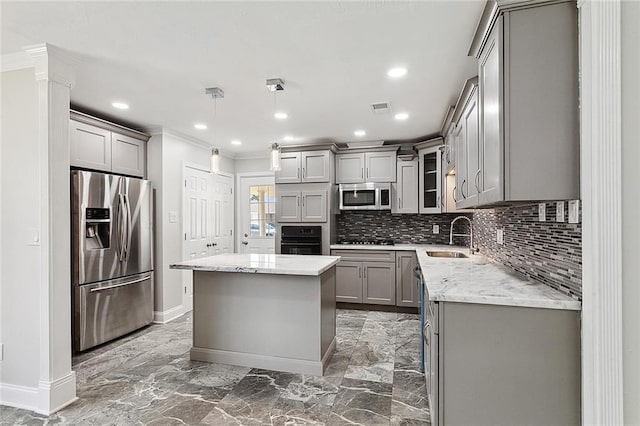 kitchen with a sink, visible vents, gray cabinets, and stainless steel appliances