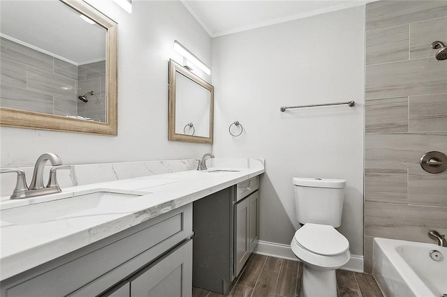 full bath featuring ornamental molding, toilet, wood tiled floor, and a sink