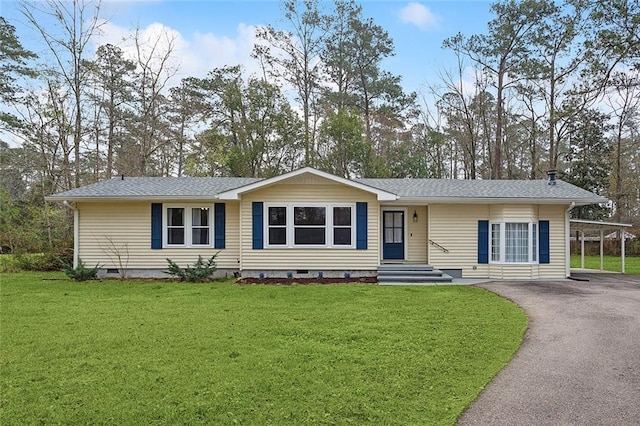 ranch-style home with crawl space, aphalt driveway, a front yard, and roof with shingles