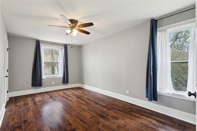 72462 Wilkinson St, Covington, LA 70435 - spare room with baseboards, a ceiling fan, and dark wood-style flooring