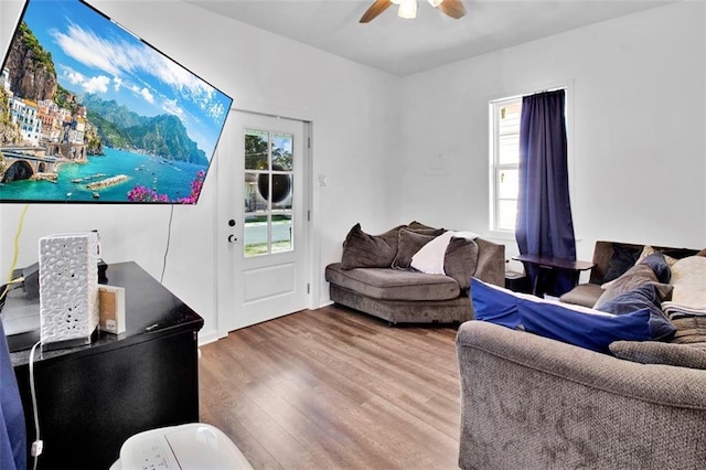 living room featuring wood finished floors and ceiling fan