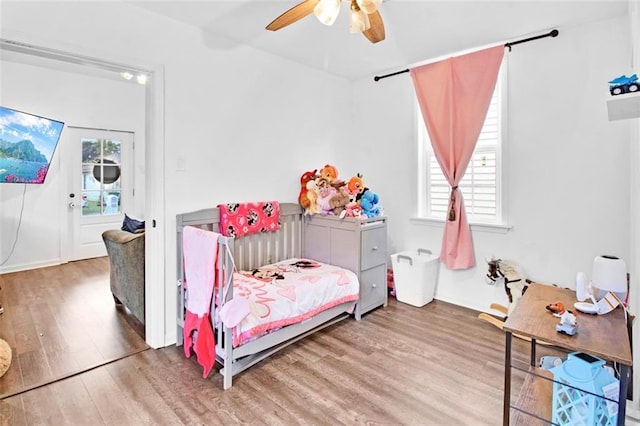 bedroom featuring ceiling fan and wood finished floors