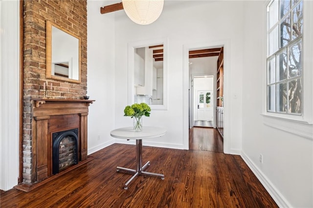 hallway with baseboards and dark wood-style floors