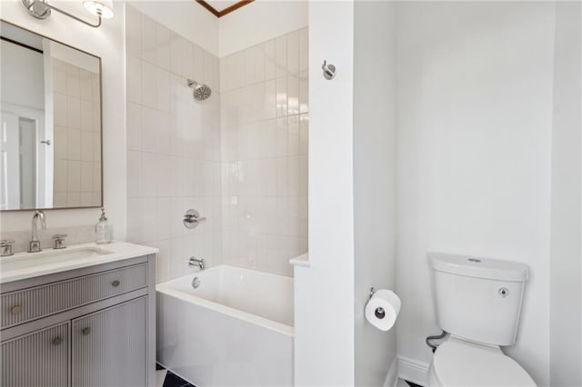 bathroom with vanity, toilet, and tub / shower combination