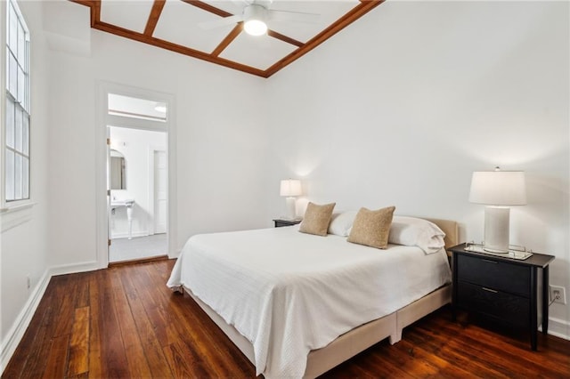 bedroom featuring a ceiling fan, baseboards, ornamental molding, hardwood / wood-style flooring, and ensuite bathroom