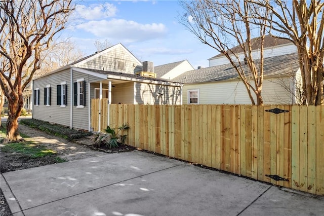 view of property exterior featuring a fenced front yard