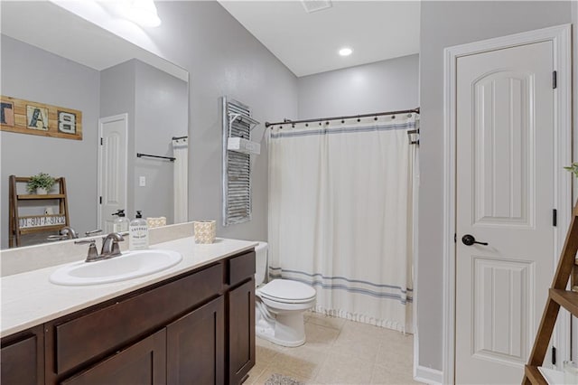 full bathroom featuring tile patterned floors, curtained shower, toilet, and vanity