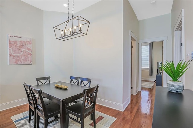 dining room featuring baseboards and wood finished floors