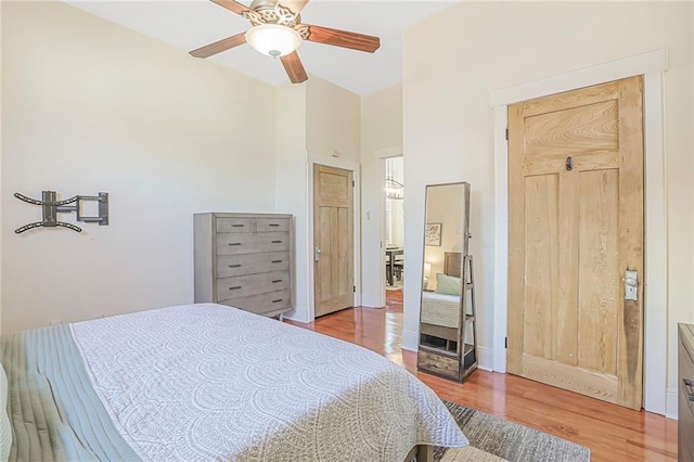 bedroom with ceiling fan and wood finished floors