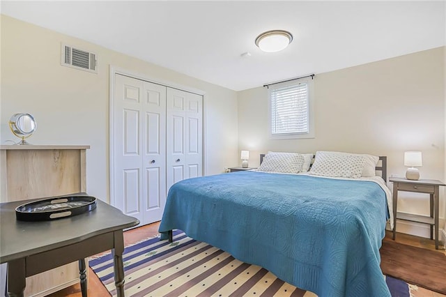 bedroom with visible vents and a closet