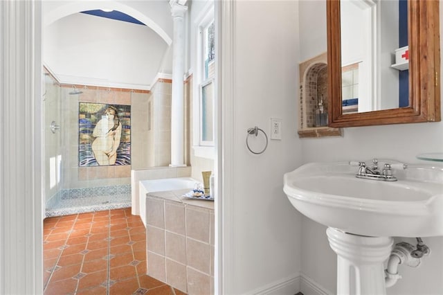 full bathroom featuring a shower stall, a tub to relax in, and tile patterned floors