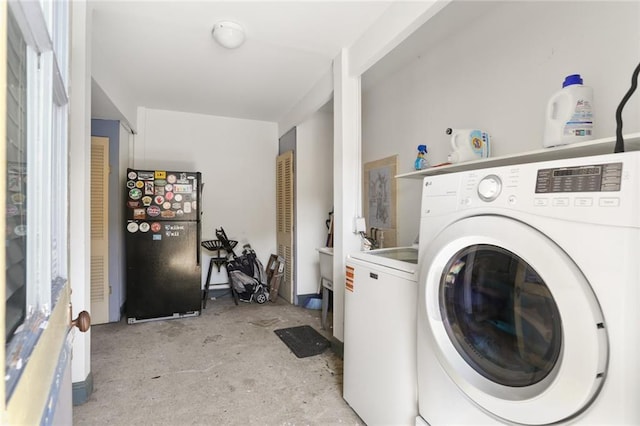 laundry area with laundry area and separate washer and dryer
