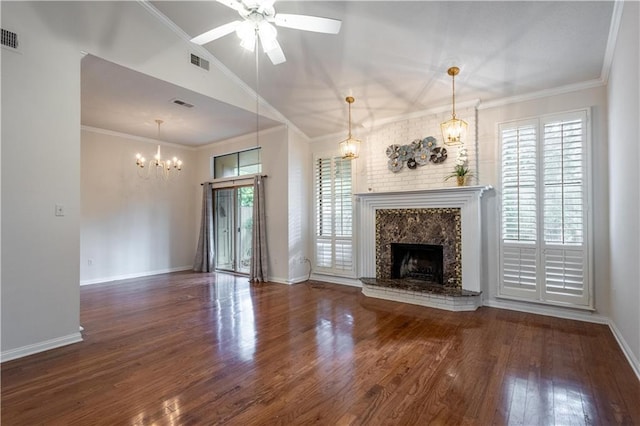 unfurnished living room with visible vents, wood finished floors, a high end fireplace, crown molding, and vaulted ceiling