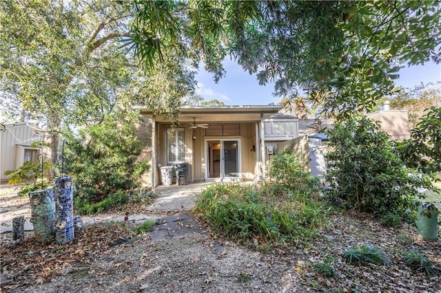 view of front of home with french doors and ceiling fan