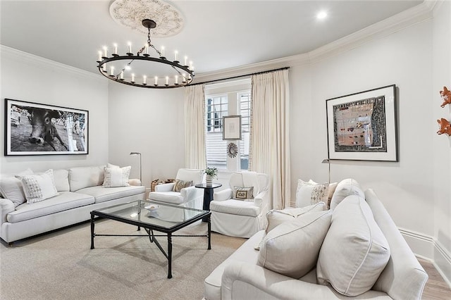 living room featuring wood finished floors, baseboards, a chandelier, and crown molding