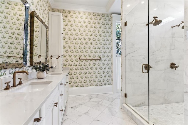 full bathroom featuring a marble finish shower, wallpapered walls, a sink, crown molding, and marble finish floor