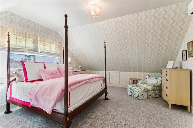 carpeted bedroom with lofted ceiling, an AC wall unit, and wallpapered walls